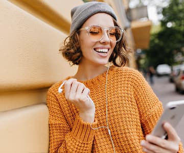 Happy student learning on a smartphone