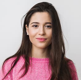 Camila Garcia from Marketing in front of a neutral background